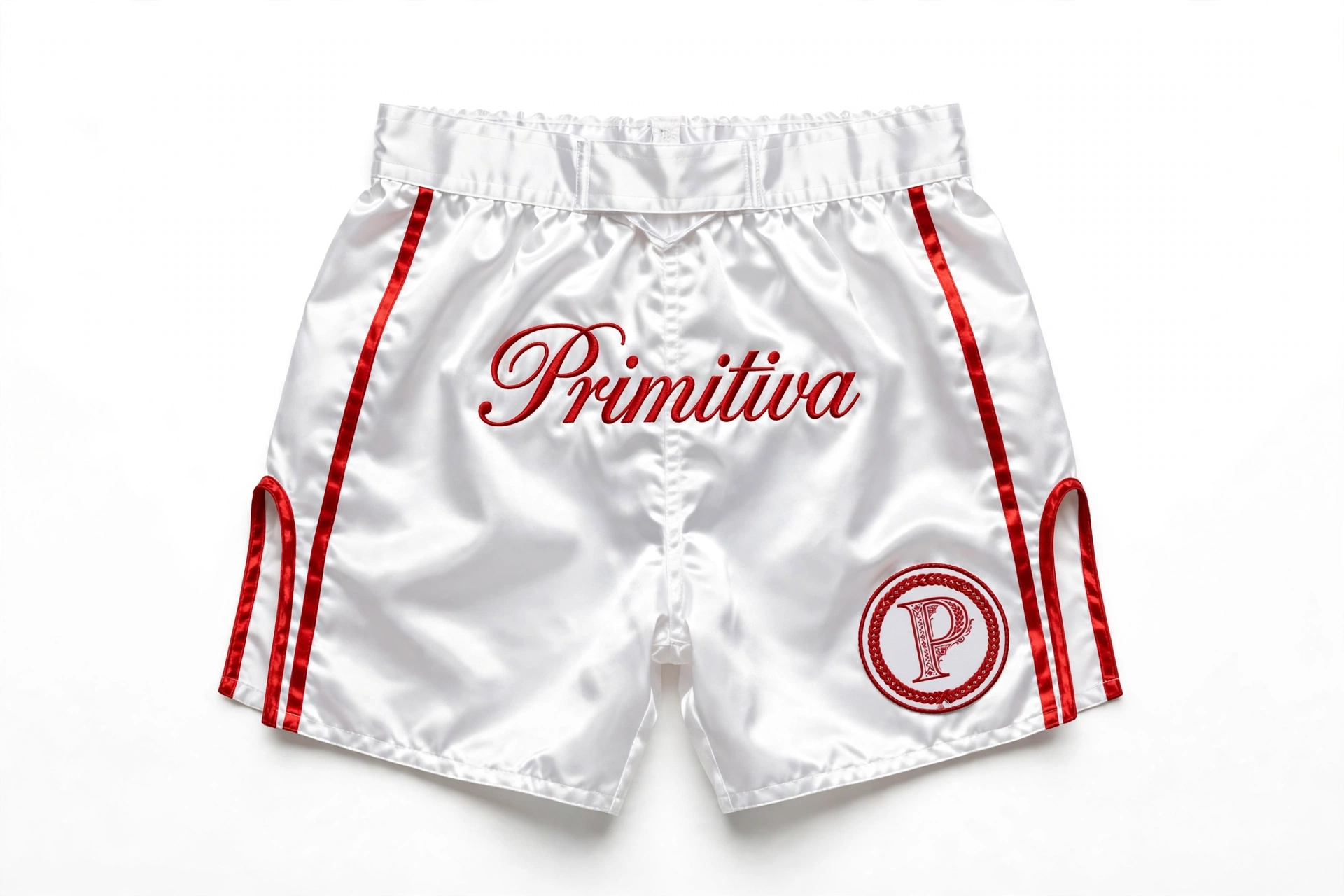 Primitiva fight shorts in white and red with script wordmark and monogram